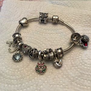 Pandora bracelet with 11 charms and two dividers